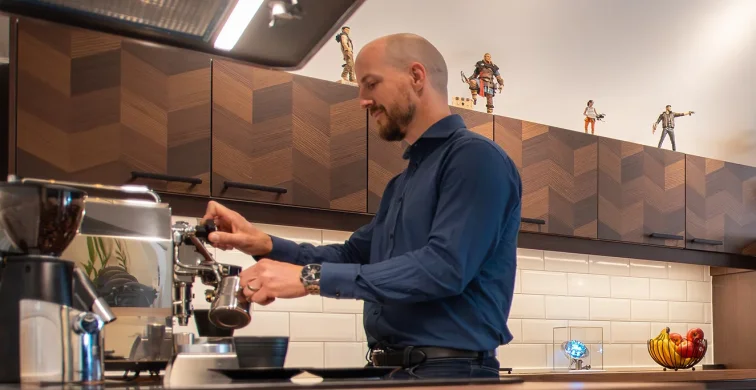 Team member preparing coffee in the studio kitchen