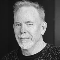 Black-and-white portrait of Tom Keegan